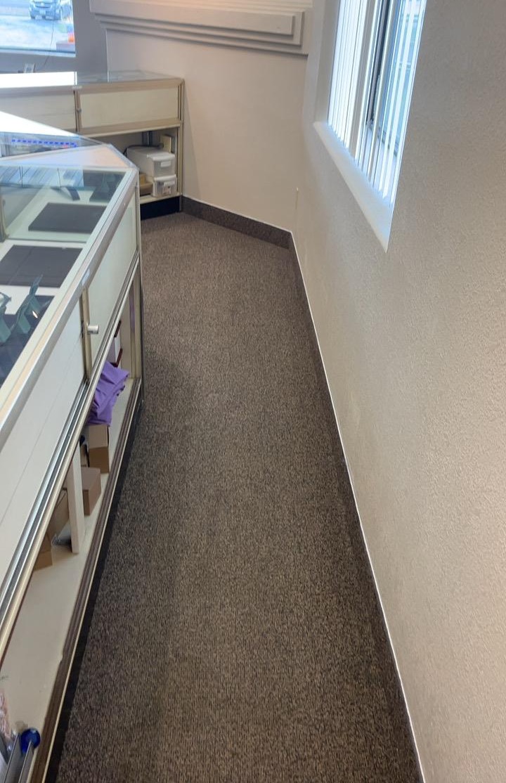 Finished interior wall and trim work inside a local business showroom.